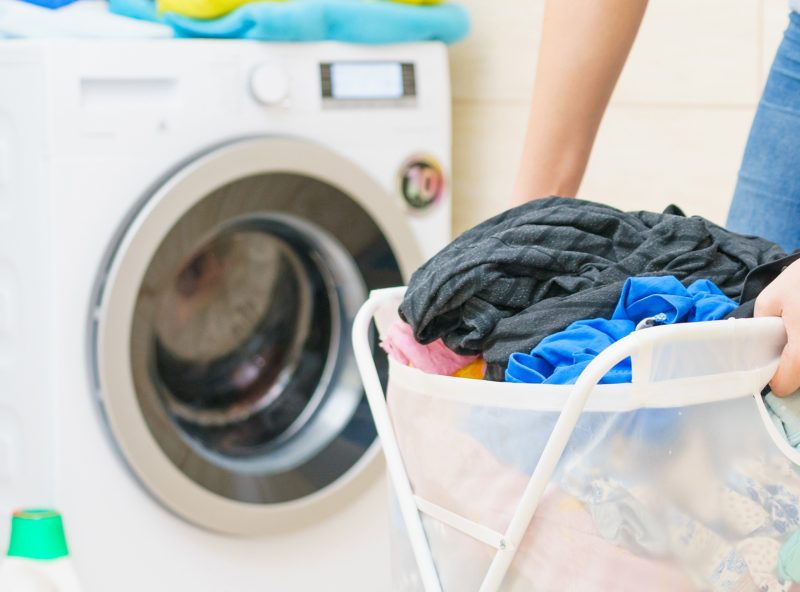 woman-holding-laundry-basket-full-of-clothes_mostphotos_2400px